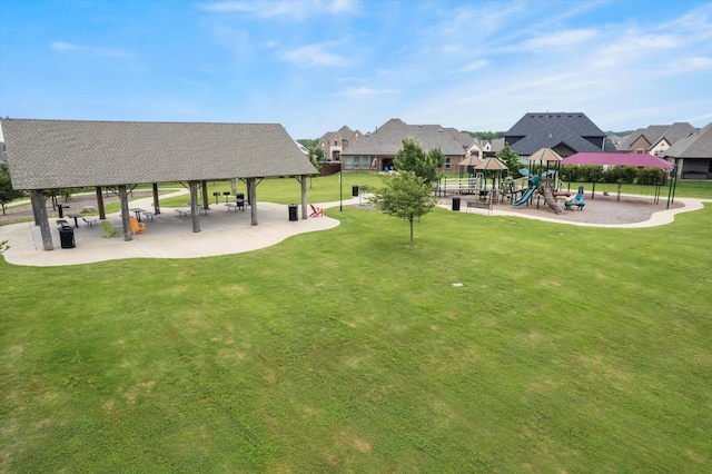 view of home's community featuring a playground, a yard, and a gazebo