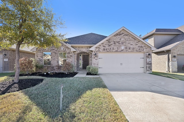 view of front facade with a garage and a front lawn