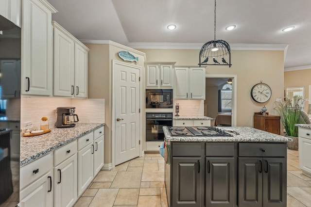 kitchen with white cabinetry, pendant lighting, light stone countertops, and black appliances