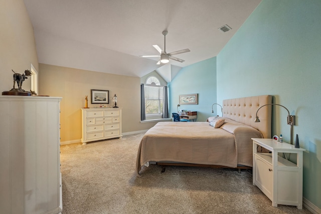 bedroom featuring lofted ceiling, light colored carpet, and ceiling fan