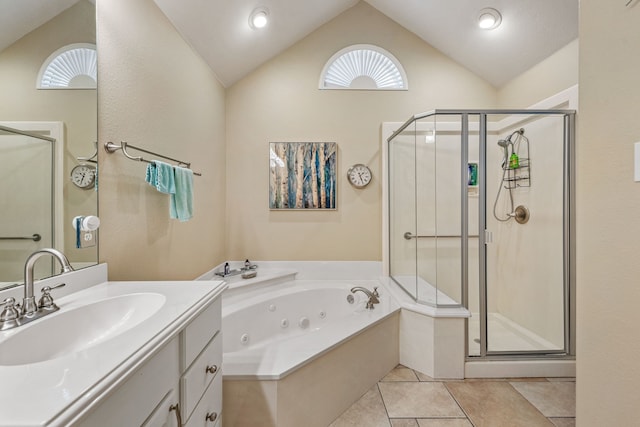 bathroom with tile patterned flooring, vanity, vaulted ceiling, and separate shower and tub