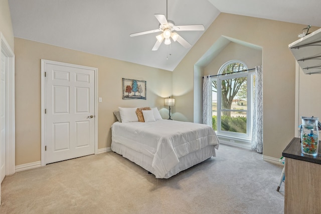 carpeted bedroom featuring vaulted ceiling and ceiling fan