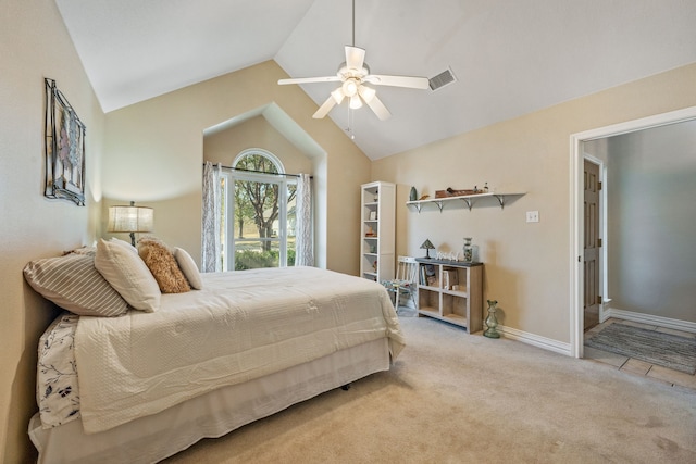 bedroom featuring lofted ceiling, light colored carpet, and ceiling fan