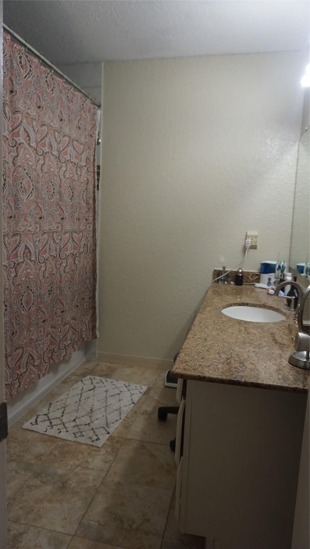 bathroom with vanity, tile patterned floors, and shower / bathtub combination with curtain