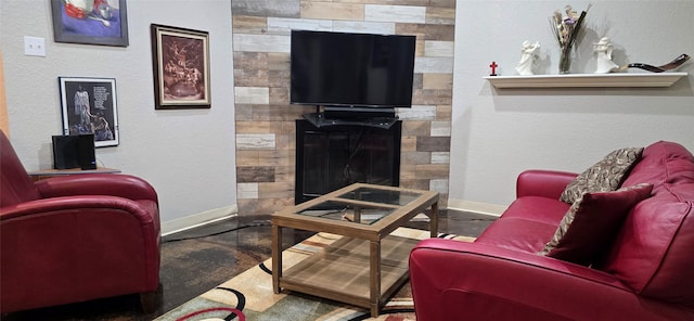 living room featuring a tiled fireplace