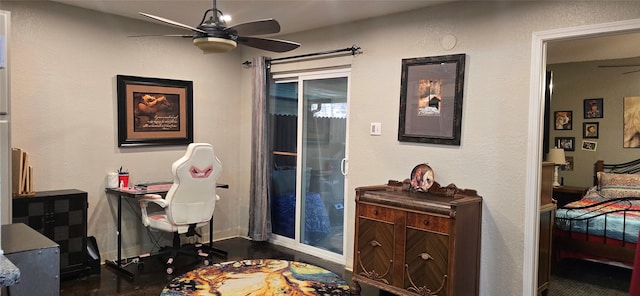 office area with ceiling fan and dark hardwood / wood-style flooring