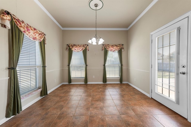 unfurnished dining area featuring a chandelier, crown molding, and a healthy amount of sunlight