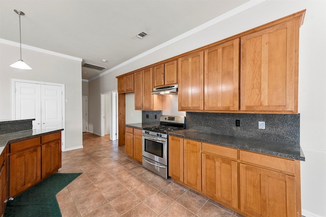 kitchen featuring decorative light fixtures, backsplash, dark stone counters, and gas range