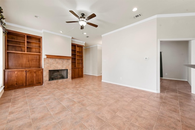 unfurnished living room with a tile fireplace, light tile patterned floors, ceiling fan, and crown molding