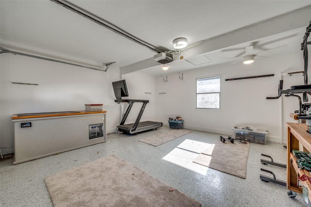 exercise room with ceiling fan