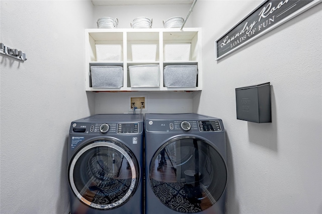 laundry room with separate washer and dryer