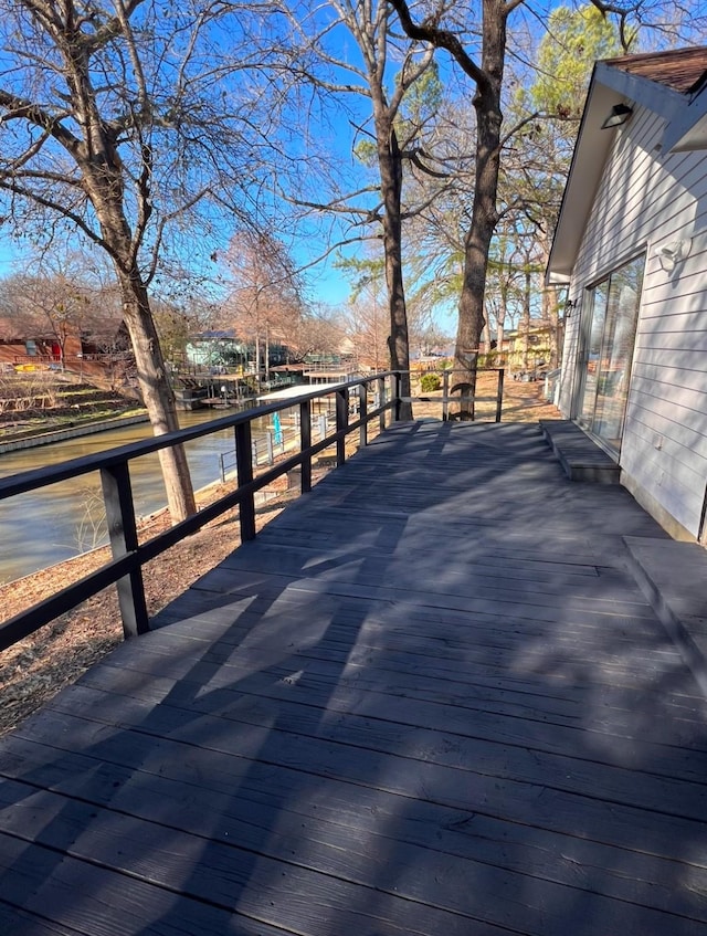 wooden terrace with a water view