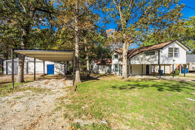 view of yard featuring an outbuilding and a carport