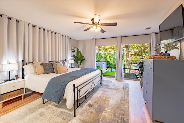 bedroom featuring access to outside, ceiling fan, and light hardwood / wood-style flooring