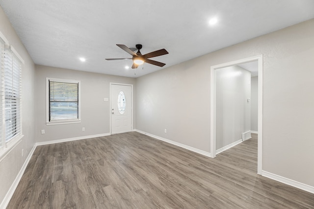 foyer featuring hardwood / wood-style flooring and ceiling fan