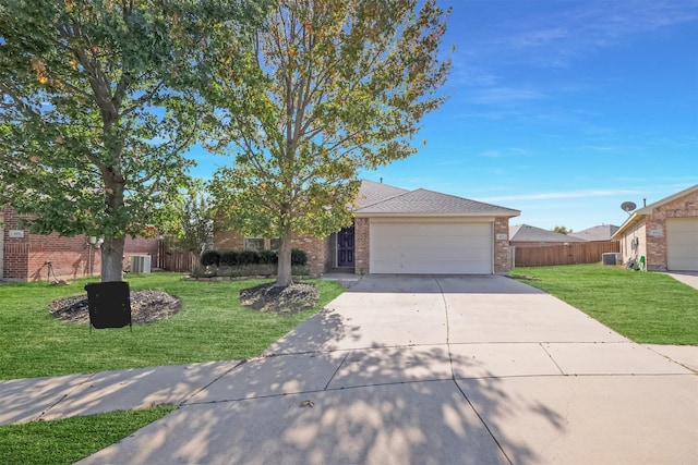 single story home with cooling unit, a garage, and a front yard