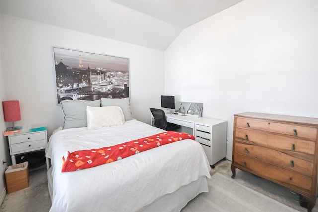 bedroom with light carpet and vaulted ceiling