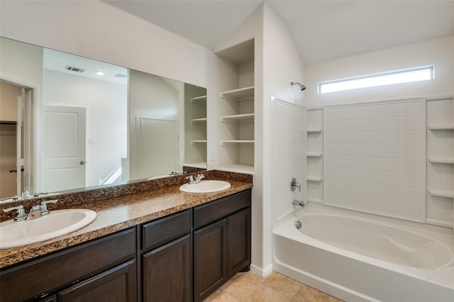 bathroom featuring tile patterned flooring, vanity, and shower / bathtub combination