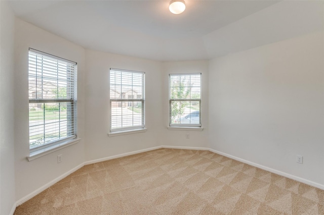 empty room with light colored carpet