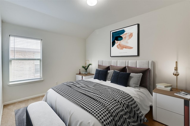 bedroom featuring carpet floors and lofted ceiling