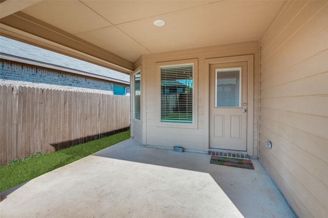 property entrance featuring a patio