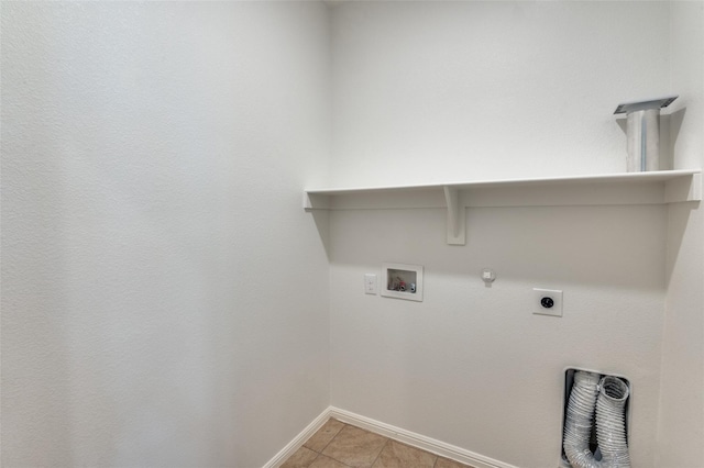 washroom featuring hookup for an electric dryer, hookup for a gas dryer, light tile patterned flooring, and hookup for a washing machine