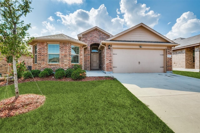 single story home with a garage and a front lawn