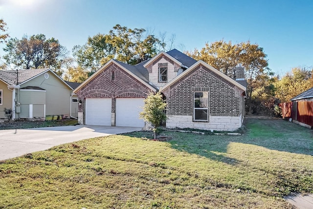 view of front of house featuring a garage and a front yard