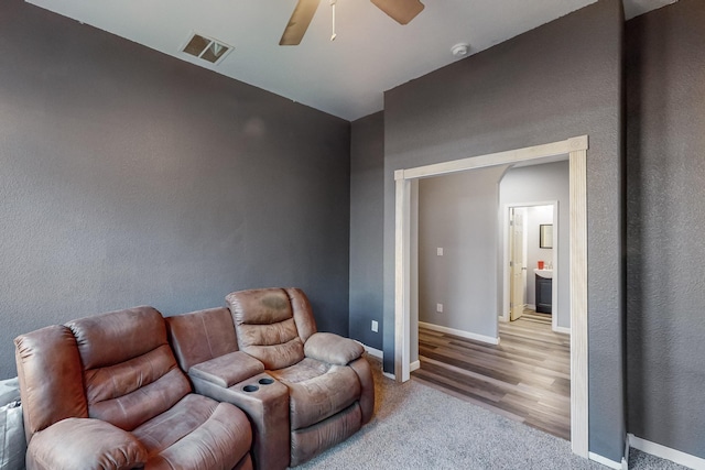 living room featuring hardwood / wood-style flooring and ceiling fan