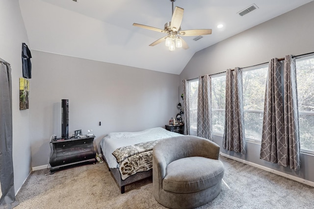 bedroom with ceiling fan, light carpet, and vaulted ceiling