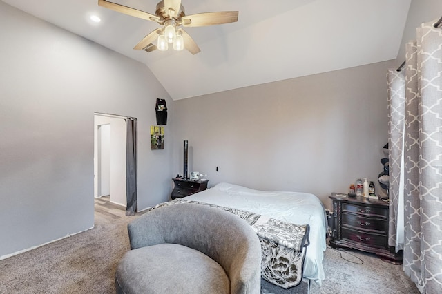 bedroom featuring ceiling fan, lofted ceiling, and light carpet