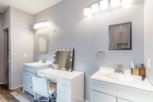 bathroom with vanity and wood-type flooring