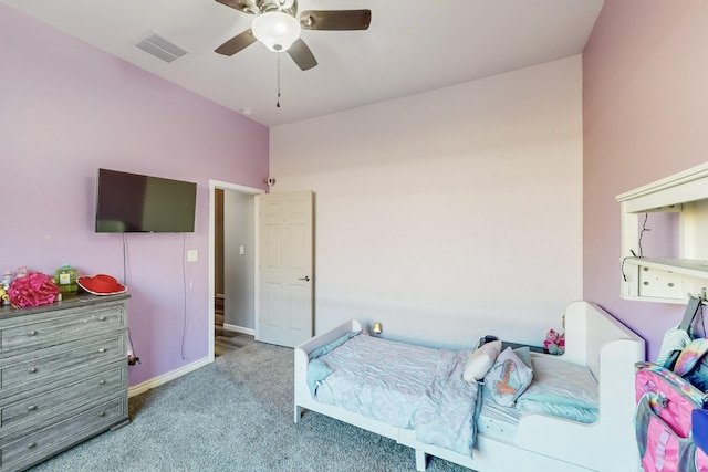 bedroom featuring ceiling fan and carpet