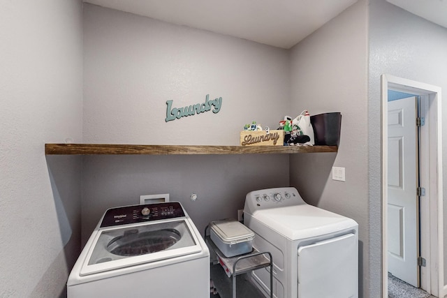 laundry area featuring washing machine and clothes dryer