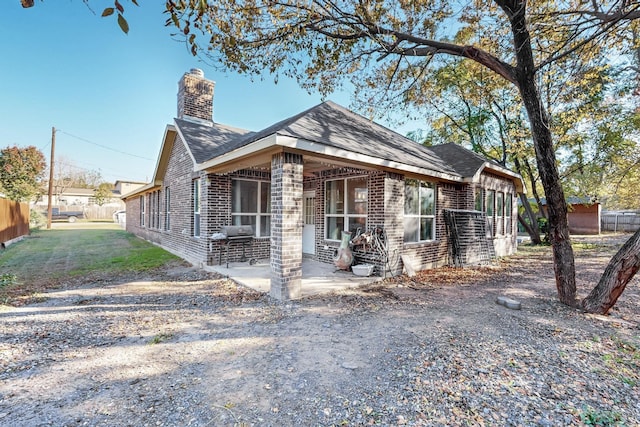 bungalow-style home featuring a patio