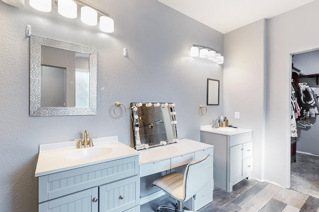 bathroom featuring hardwood / wood-style floors and vanity