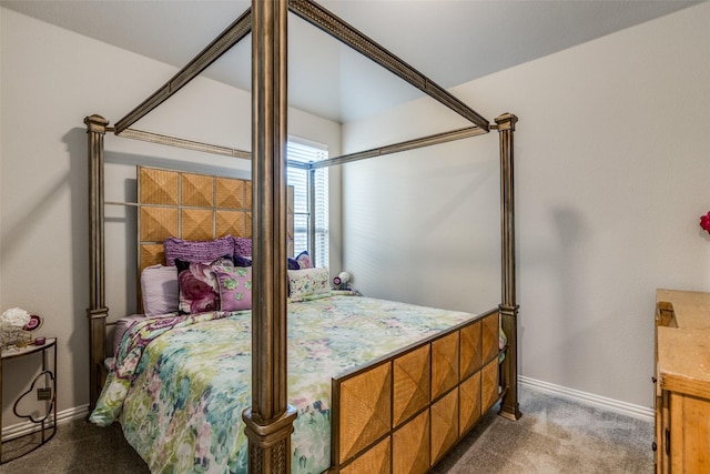 carpeted bedroom featuring baseboards