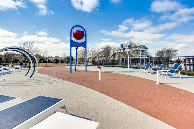 communal playground featuring fence