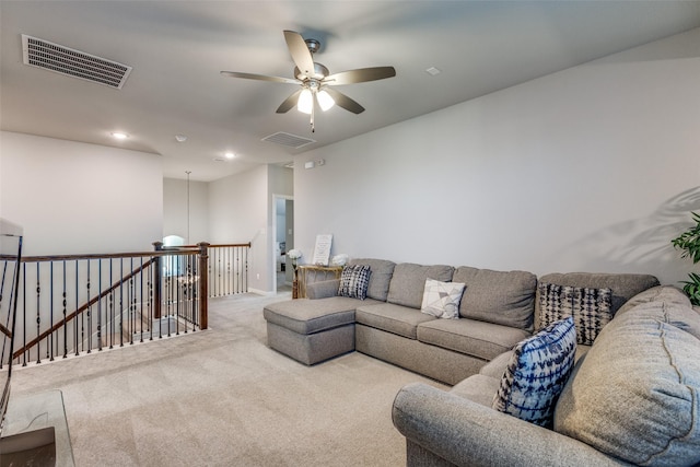 carpeted living area featuring recessed lighting, visible vents, and ceiling fan