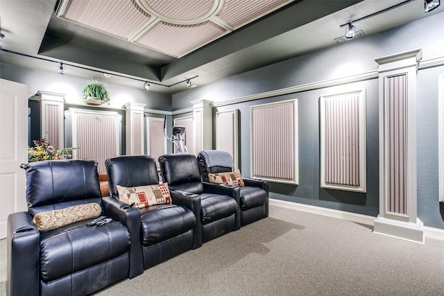 home theater room featuring carpet flooring, ornate columns, and track lighting