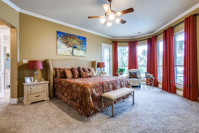 bedroom featuring ceiling fan, crown molding, and light carpet