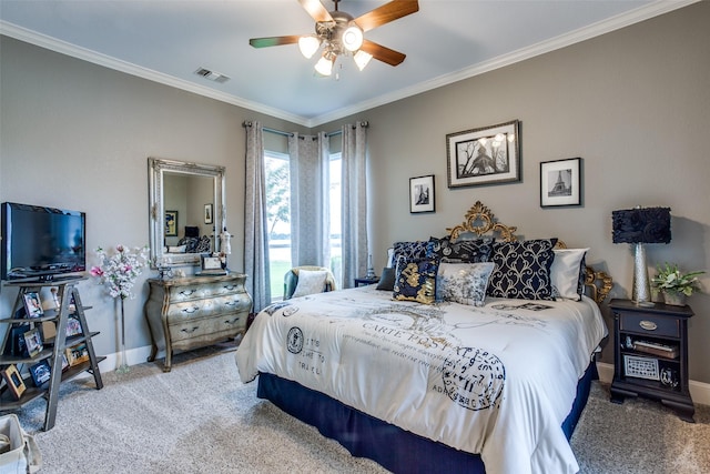 bedroom featuring carpet, ceiling fan, and crown molding