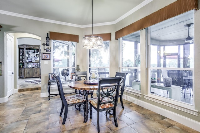 dining space featuring crown molding and ceiling fan