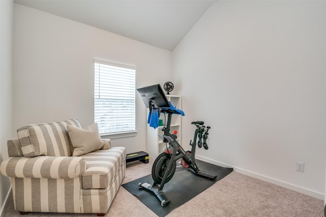 workout area with vaulted ceiling and carpet floors