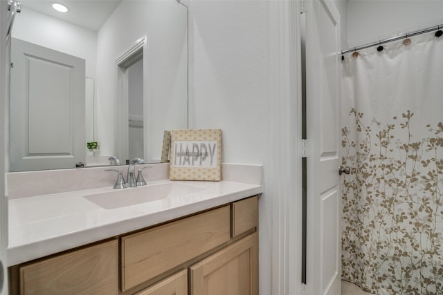 bathroom with vanity and a shower with shower curtain