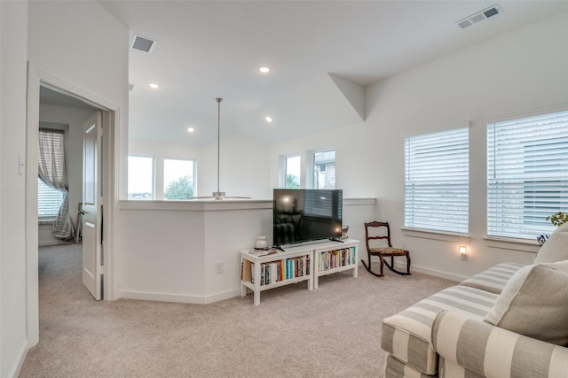 living room with ceiling fan and light colored carpet