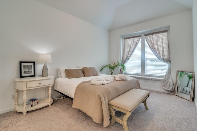 bedroom featuring carpet flooring and lofted ceiling