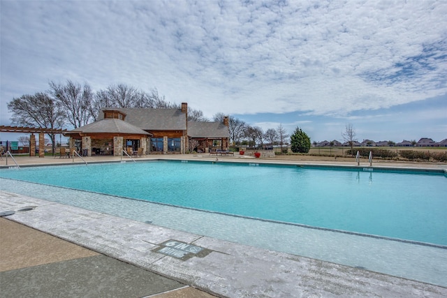 view of swimming pool with a patio area