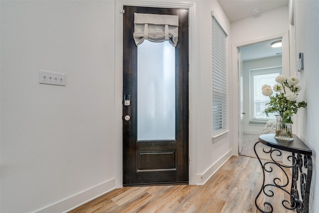 foyer with light hardwood / wood-style flooring