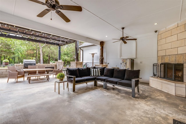 living room with concrete flooring and a fireplace